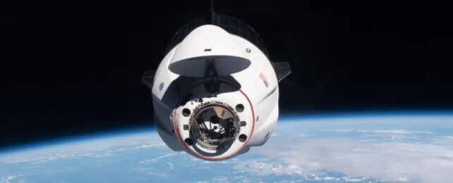 space x capsule in space above earth