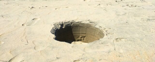 Deep Hole In Sand At Beach