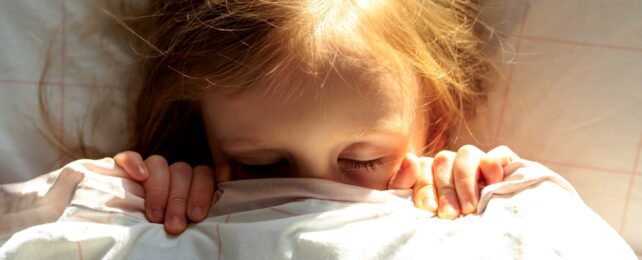 Little Girl In Bed