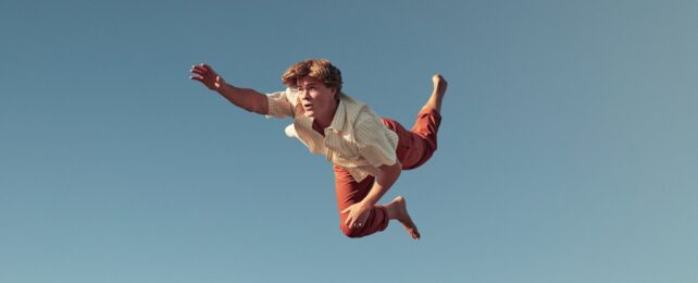 man flying through sky