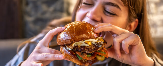 person eating a burger