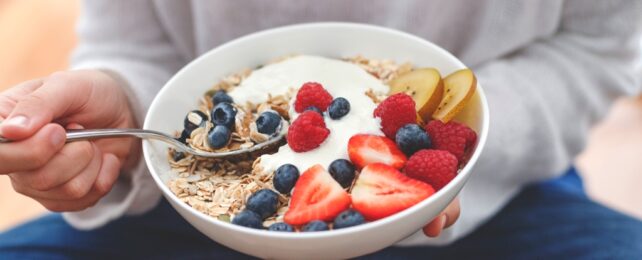 Person Eats Food From Bowl