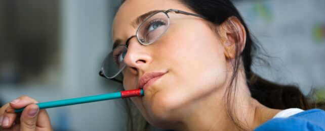 Student Chews On Pencil Thoughtfully