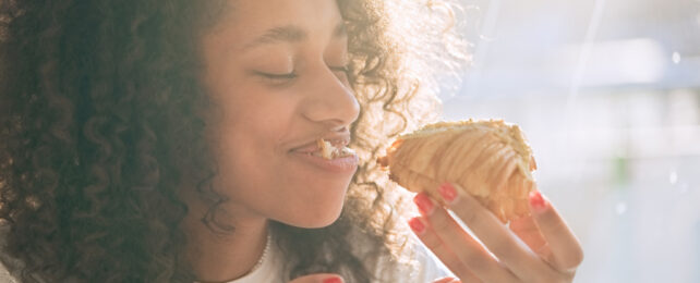 woman eating a pastry