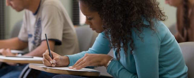 woman at desk doing a test